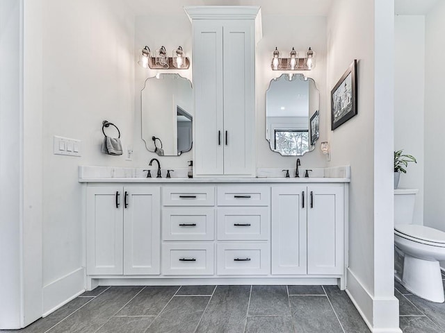 1170 Upper Sweetwater Trl SE, White, GA 30184 - full bathroom featuring double vanity, toilet, baseboards, and a sink