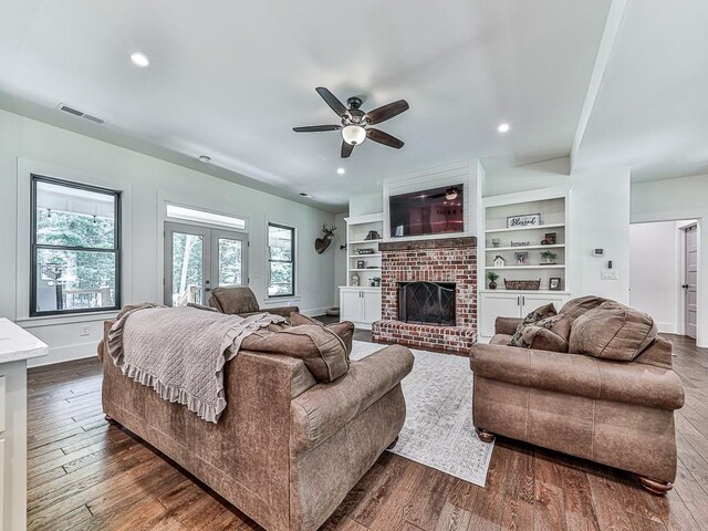 1170 Upper Sweetwater Trl SE, White, GA 30184 - living area featuring dark wood finished floors, baseboards, ceiling fan, and visible vents