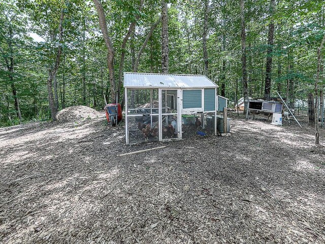1170 Upper Sweetwater Trl SE, White, GA 30184 - view of poultry coop featuring a forest view