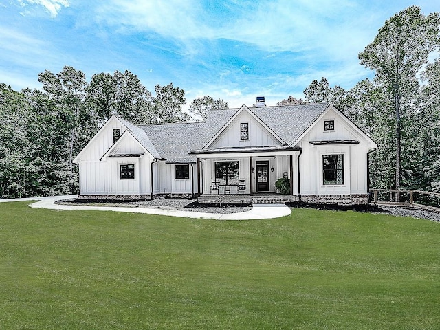 1170 Upper Sweetwater Trl SE, White, GA 30184 - modern farmhouse featuring board and batten siding, a chimney, a standing seam roof, and a front lawn