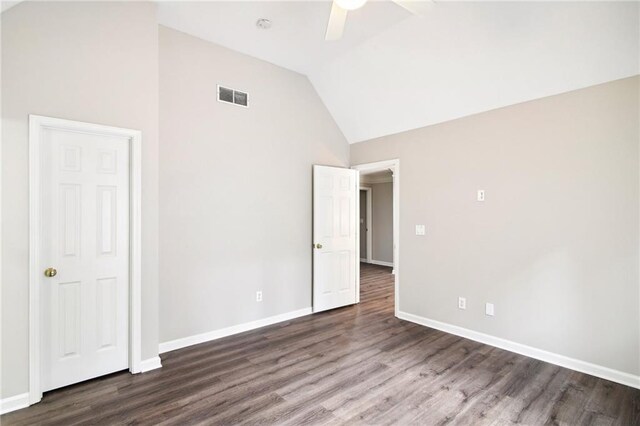 spare room with high vaulted ceiling, ceiling fan, and dark hardwood / wood-style flooring