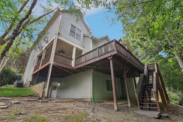 back of property with a wooden deck