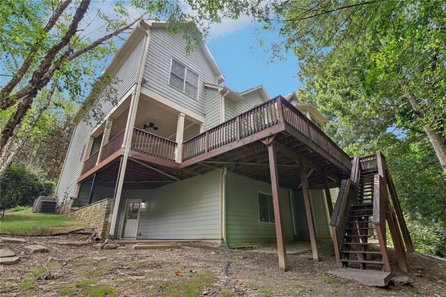 back of property featuring a wooden deck