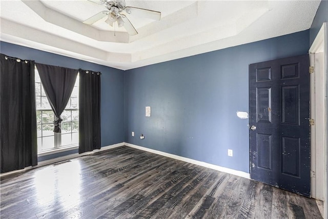 16 Bay Ct SW, Cartersville, GA 30120 - spare room featuring a raised ceiling, wood finished floors, and ceiling fan