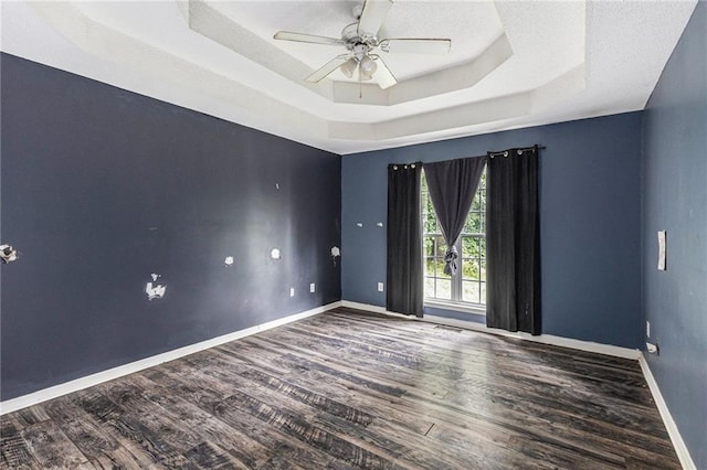16 Bay Ct SW, Cartersville, GA 30120 - spare room featuring a tray ceiling, wood finished floors, and ceiling fan