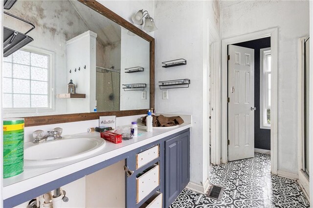 16 Bay Ct SW, Cartersville, GA 30120 - full bathroom featuring a stall shower, double vanity, and tile patterned flooring