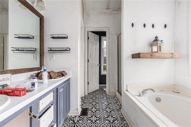16 Bay Ct SW, Cartersville, GA 30120 - full bath featuring double vanity, a garden tub, a shower stall, and tile patterned flooring