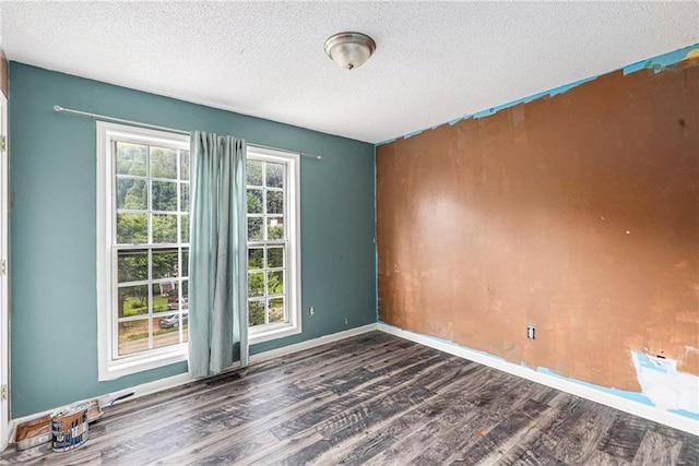 16 Bay Ct SW, Cartersville, GA 30120 - spare room with dark wood-style flooring and a textured ceiling