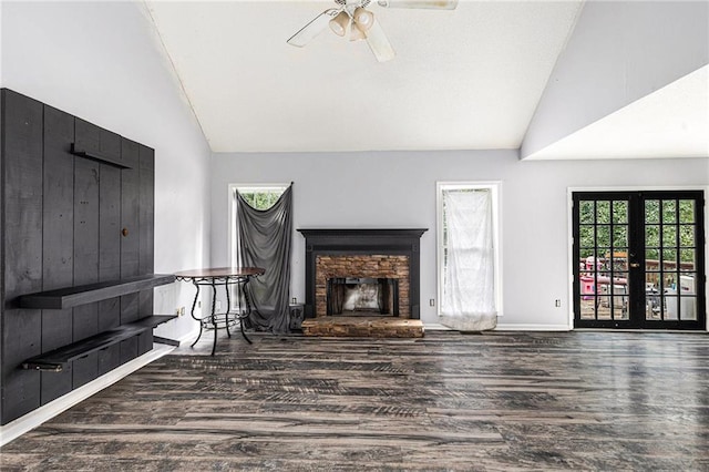 16 Bay Ct SW, Cartersville, GA 30120 - unfurnished living room featuring lofted ceiling, wood finished floors, a ceiling fan, a fireplace, and french doors