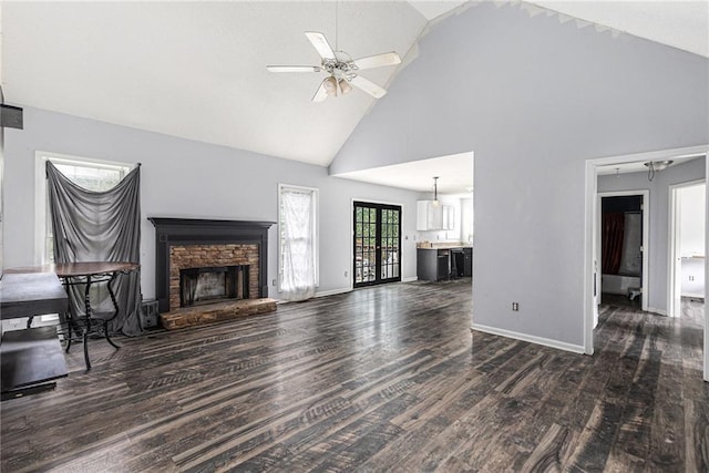 16 Bay Ct SW, Cartersville, GA 30120 - unfurnished living room featuring high vaulted ceiling, a fireplace, wood finished floors, and a ceiling fan