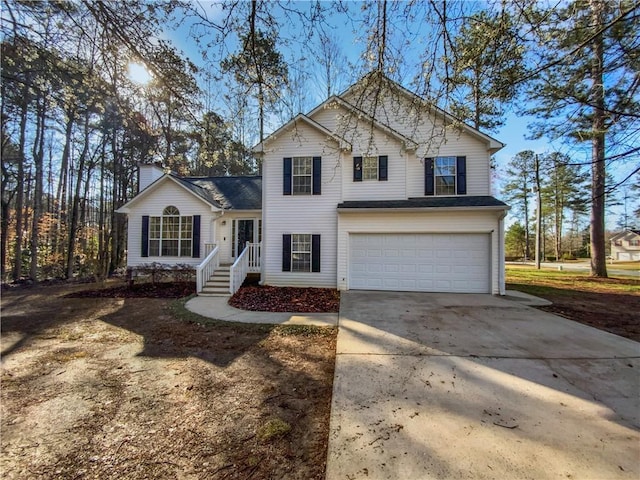 traditional home with concrete driveway and a garage