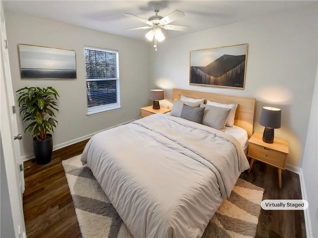 bedroom with ceiling fan, baseboards, and wood finished floors