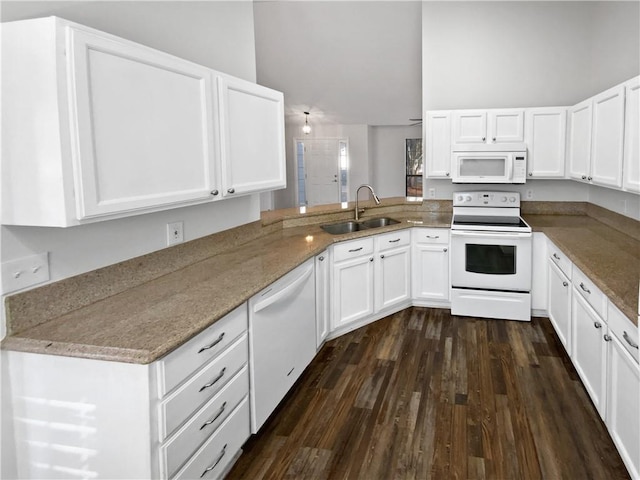 kitchen featuring white cabinetry, white appliances, dark wood-type flooring, and a sink