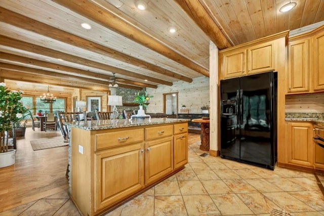 311 Bailey Farm Ln, Mineral Bluff, GA 30559 - kitchen with black fridge with ice dispenser, light stone countertops, a center island, a chandelier, and recessed lighting