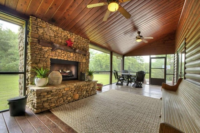 311 Bailey Farm Ln, Mineral Bluff, GA 30559 - sunroom / solarium featuring a fireplace, a ceiling fan, plenty of natural light, and vaulted ceiling