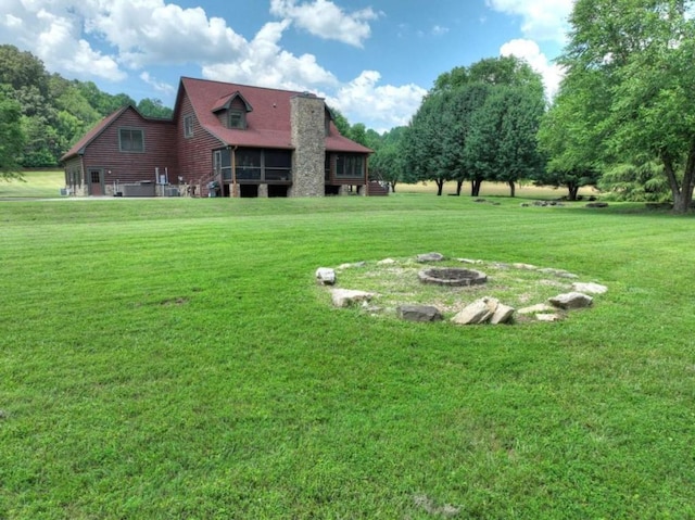 311 Bailey Farm Ln, Mineral Bluff, GA 30559 - view of green lawn with a fire pit and a sunroom