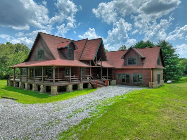 311 Bailey Farm Ln, Mineral Bluff, GA 30559 - view of front of house with gravel driveway, a front lawn, and stone siding