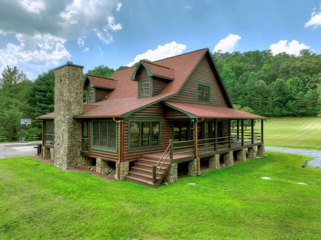 311 Bailey Farm Ln, Mineral Bluff, GA 30559 - log home featuring a chimney, a front lawn, and a shingled roof