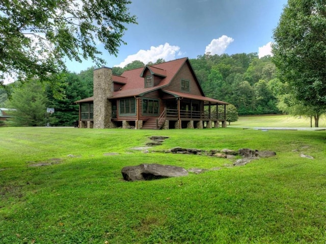 311 Bailey Farm Ln, Mineral Bluff, GA 30559 - rear view of house featuring a yard and a sunroom