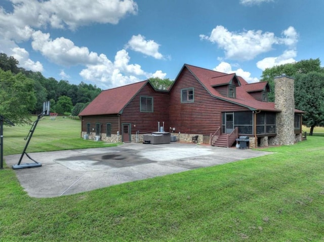 311 Bailey Farm Ln, Mineral Bluff, GA 30559 - back of property featuring a sunroom, a chimney, a lawn, and a patio