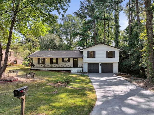 split level home with covered porch and a front yard