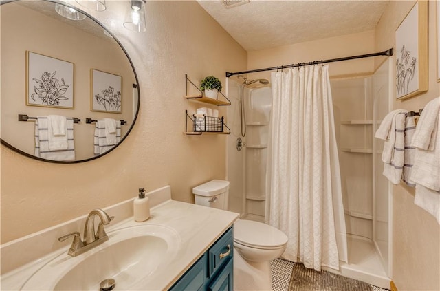 bathroom featuring a shower with shower curtain, toilet, tile patterned flooring, a textured ceiling, and vanity