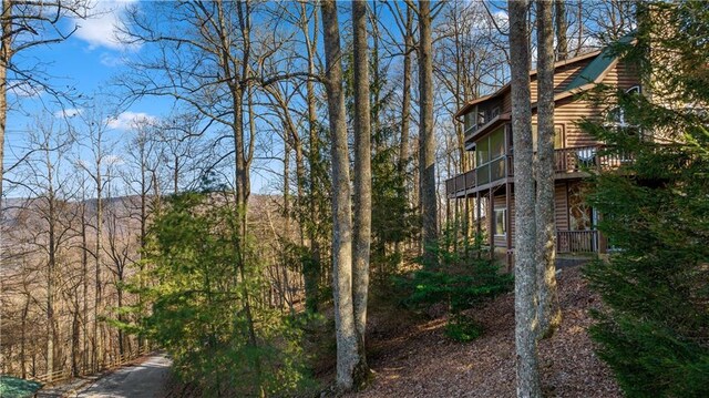 view of side of property with faux log siding