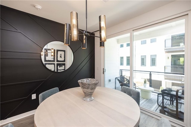 dining area with hardwood / wood-style flooring