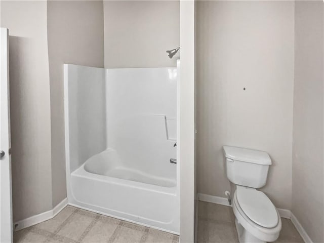 bathroom with toilet and shower / bathtub combination