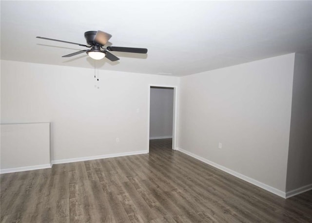 empty room featuring wood finished floors, ceiling fan, and baseboards