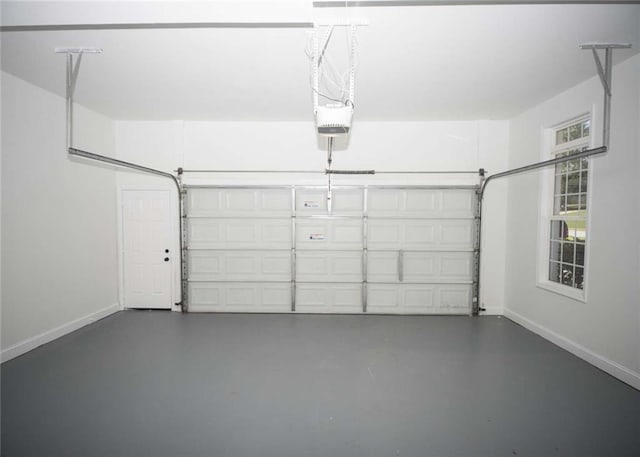 garage featuring baseboards and a garage door opener