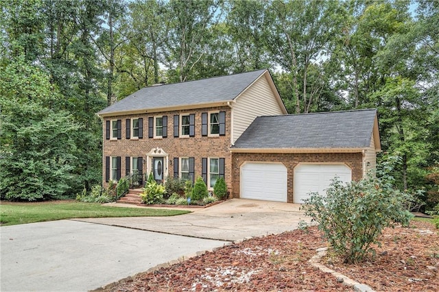 colonial-style house featuring a garage