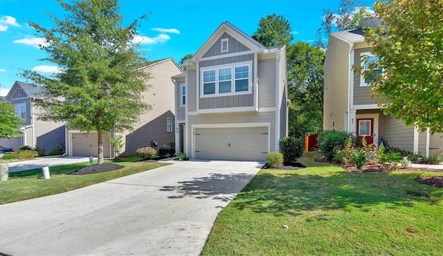 view of front of home featuring a front yard and a garage