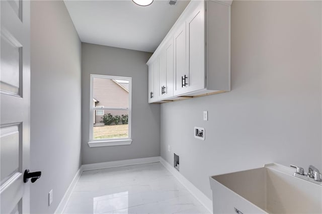 clothes washing area with hookup for a washing machine, marble finish floor, a sink, cabinet space, and electric dryer hookup