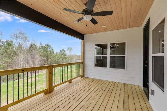 wooden deck featuring a ceiling fan