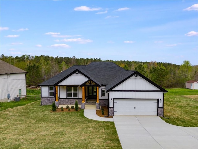 view of front of house featuring driveway, a garage, a front lawn, and board and batten siding