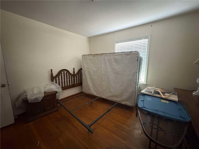 bedroom featuring dark hardwood / wood-style floors