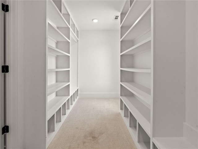 walk in closet with carpet and visible vents