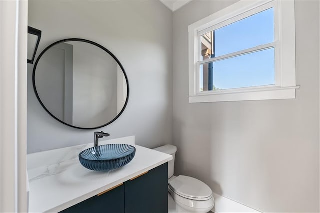 bathroom featuring vanity and toilet