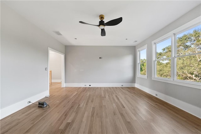 spare room with ceiling fan and light hardwood / wood-style flooring