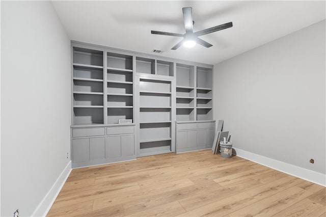 unfurnished bedroom with ceiling fan and light hardwood / wood-style flooring