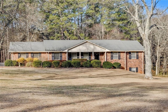 ranch-style home with a front lawn