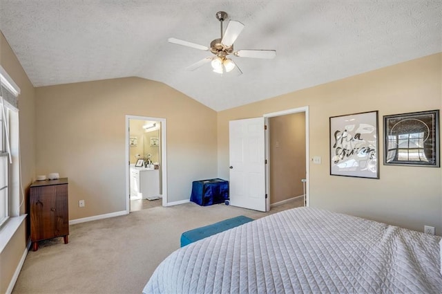 carpeted bedroom with ceiling fan, connected bathroom, lofted ceiling, and a textured ceiling