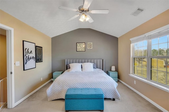 bedroom with light carpet, ceiling fan, and lofted ceiling