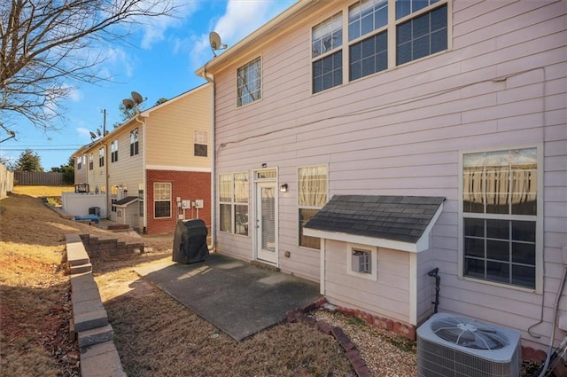 back of house featuring central air condition unit and a patio