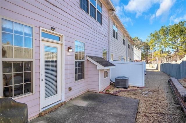 view of property exterior featuring a patio and central AC