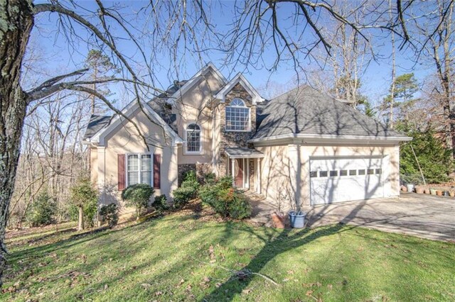 front of property with a front lawn and a garage