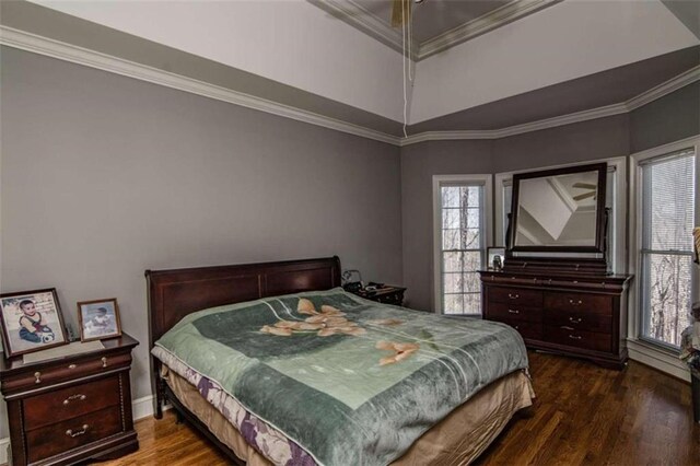 bedroom with crown molding and wood-type flooring