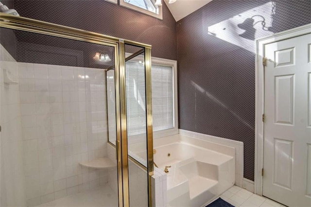 bathroom featuring wallpapered walls, tile patterned flooring, a bath, and a shower stall