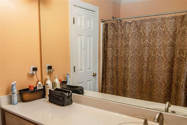 bathroom featuring a shower with curtain, crown molding, and vanity